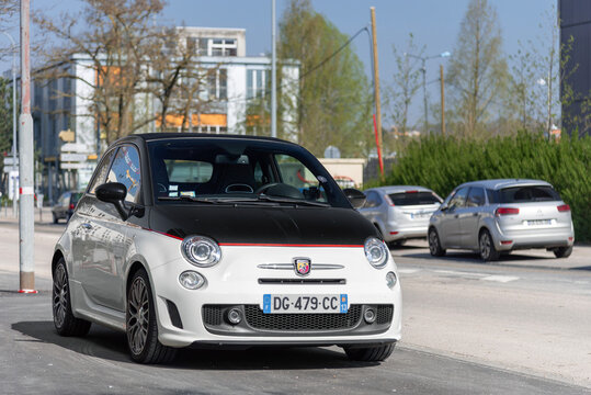 Nancy, France - April 15th 2019 : View on a white and black Abarth 595 Turismo parked on a street.
