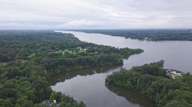 Drone aerial of Hoover Reserver near Westerville, OH and Big Walnut Creek by Columbus, Ohio body of water and manmade lake with trees, expensive house homes, and river ways along midwestern shorelines