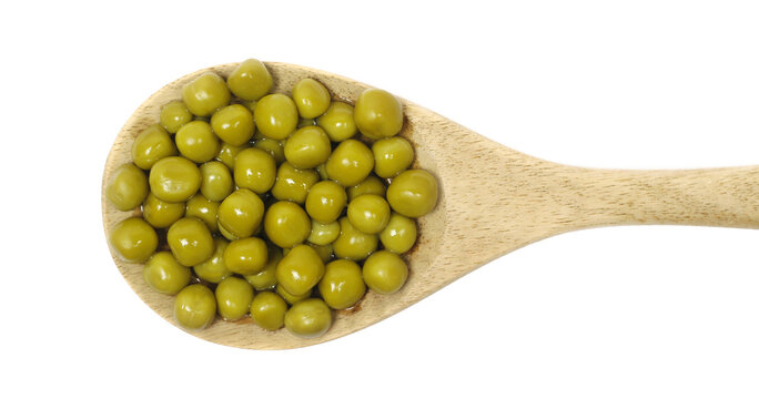 Boiled green peas pile in wooden spoon isolated on white background, top view