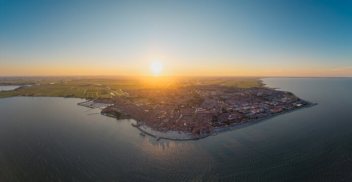 Sunset panorama of Volendam between two waters