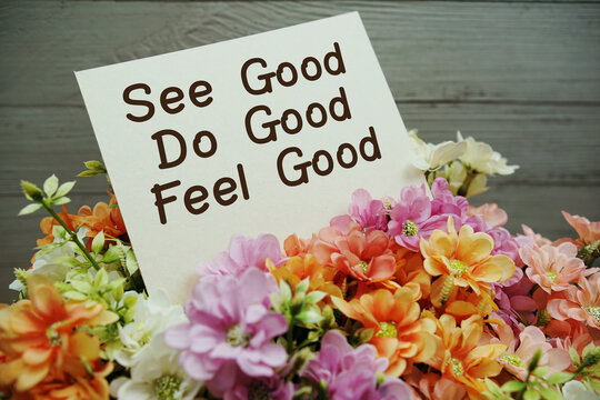 See Good Do Good Feel Good text written on paper card with flowers decorations