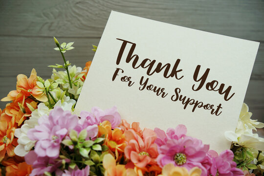 Thank You For Your Support text written on paper card with flowers decorations