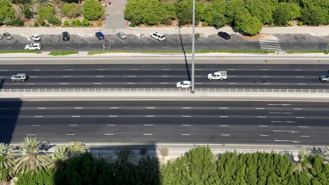 High angle view of highway traffic along the waterfront marina in Manama, Bahrain.