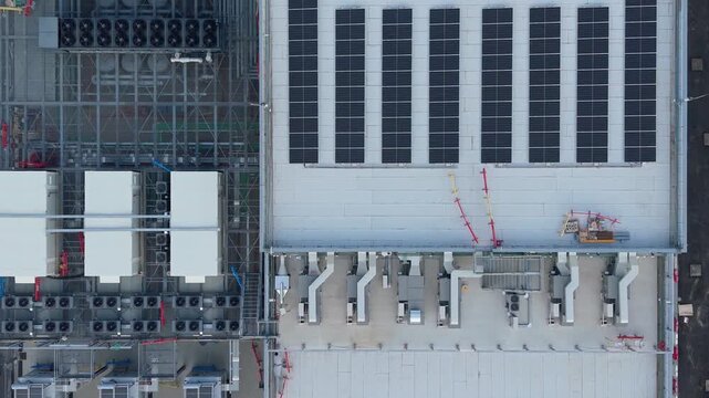 Top-down aerial view of a modern data center facility in Italy