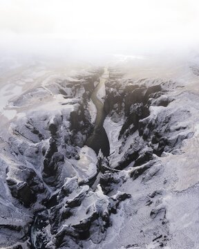 Aerial view, Fja&eth;r&aacute;rglj&uacute;fur Canyon with golden light and clouds, Kirkjub&aelig;jarklaustur, Iceland