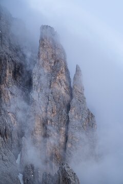 Rock face framed by clouds, Furchetta, Geisler Alm, South Tyrol, Italy