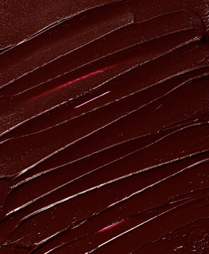 dark red burgundy plum lipstick smear, cosmetics beauty product texture, liquid blush, lipstick, lip gloss swatch