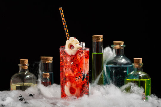 Spooky Halloween Cocktail With Potion Bottles And Cobwebs For Themed Party And Celebration