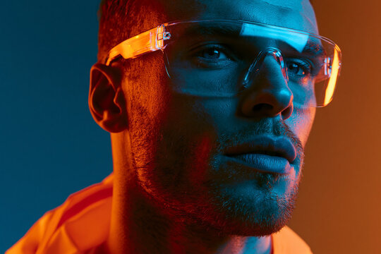 Futuristic Man Wearing High Tech Smart Glasses in Neon Light