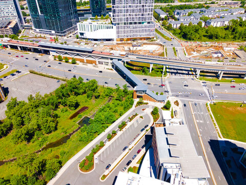 Aerial view of road interchanges, subway line, highways and skyscrapers in downtown Tyson's Corner, Virginia.
