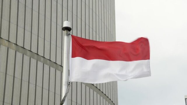 The Indonesian flag on a flag pole at Toronto City Hall&rsquo;s Nathan Phillips Square.