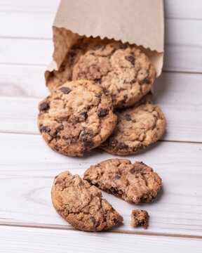 Chocolate chip cookies over wooden table