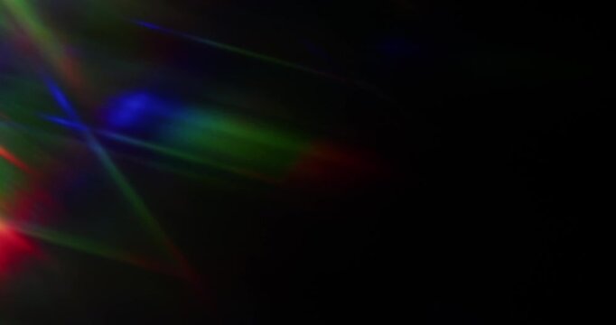 Lights shining into a prism causing an optical effect of a brilliant rainbow of dancing light rays. Light reflect creating a visual of a dreamy burst of light shining and sparkling. Seamless Loop.