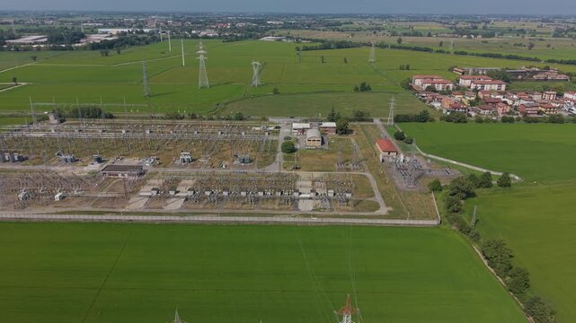 Aerial View of Lacchiarella Electrical Substation and High Voltage Power Grid Badile, Milan, Italy
