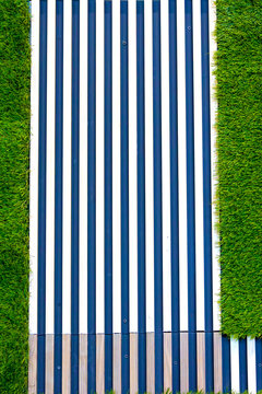 Wood vertical stripes on grass ground wall pattern background