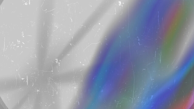 White rainbow star burst crosses dark backdrop showing blue green swirl and bright diagonal flare smoothly