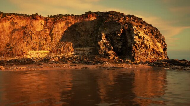 Quiet cove beneath golden cliff, calm reflective water and sheltered bay creating safe coastal refuge vibe suitable for conservation and travel visuals