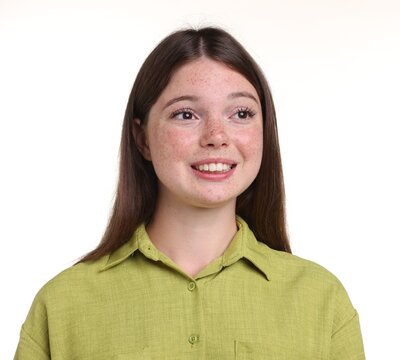 Beautiful girl with freckles on white background