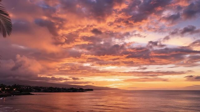 Tracking pan of palm tree silhouettes glowing over ocean coastline during vibrant sunset on tropical seaside bay, calm evening mood and warm colorful sky