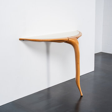 console table with wooden frame and glass top.