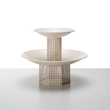 two-tier stand in perforated white metal.