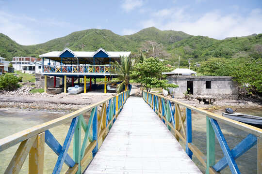 Vibrant Caribbean dock overlooking Santa Isabel and tropical hills, Providencia Island, Colombia
