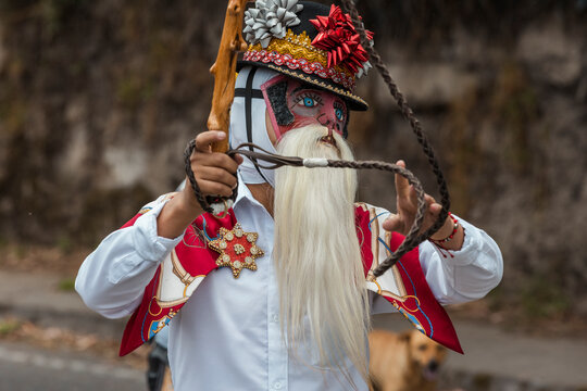 Chivo character in traditional attire performing at the cultural festival of Zuleta, Ecuador