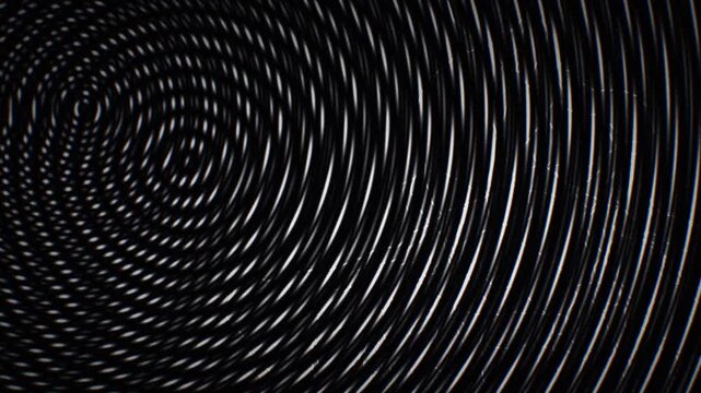 Seamless loop animation: dark cinematic grain in black and white monochrome concentric wave ripples with branching lightning, great for motion background, titles, VJ set, and screensaver.