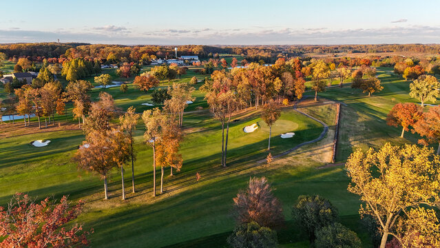 Aerial View of a Golf Course in Autumn with Colorful Fall Foliage in Greenville, Delaware