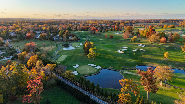 Aerial View of a Golf Course in Autumn with Colorful Fall Foliage in Greenville, Delaware