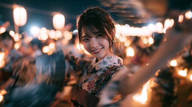 Young Japanese Woman in Yukata Dancing at Summer Festival