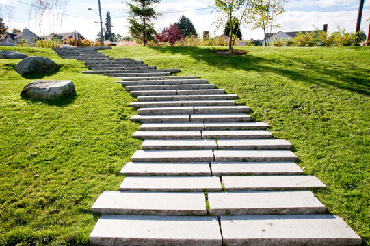 Concrete Stepping Stone Path Through Green Grass
