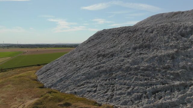 White Salt Mountain Aerial Side View Over Farmland