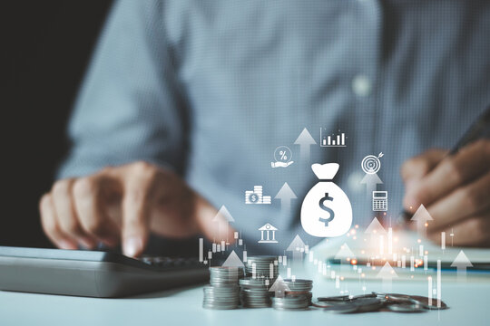 Businessman is calculating income and return on investment in percentage. Saving, finance and investment, invest money, fundraising, ROI return on investment, Interest rate and dividend concept.
