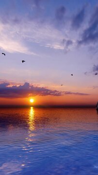 Beautiful vertical ocean sunset with the sun disappearing below the horizon, creating a peaceful seascape ideal for travel, relaxation, vacation, nature, and cinematic background content. 2160x3840