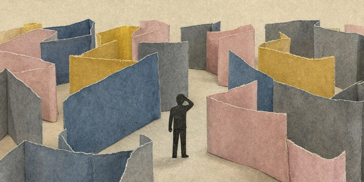 Confused paper cutout silhouette standing in a colorful folded paper maze. Miniature concept of complex choices and mental problem solving