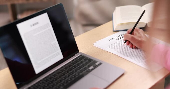 Author writing her book at desk in office, closeup