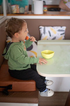 Toddler Boy Eating Papaya Independently with a Fork