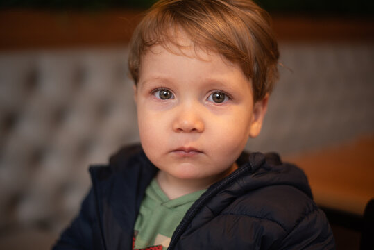 Sad Toddler Boy with Teary Eyes Looking at Camera