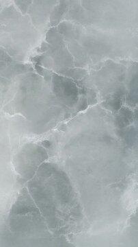 Soapstone texture featuring smooth grey green stone surface with delicate white mineral veining.