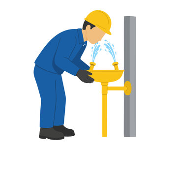 Industrial Worker Using Emergency Eyewash Station for Eye Rinsing