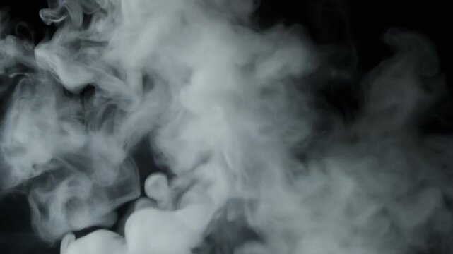Thick white smoke and vapor billow and swirl dynamically against a dark background.