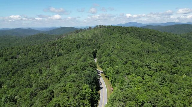 Aerial view overlooking a road leading through Oconee State Park with the foothills in the background in northwest South Carolina.