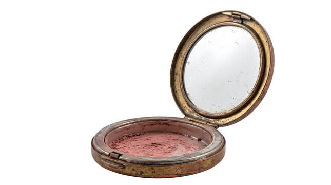 Vintage compact powder case with mirror is made of aged gold metal showing pink blush inside for antique beauty cosmetics and nostalgic vanity collections.