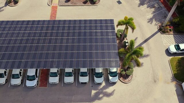 Eco-friendly car parking area covered with photovoltaic panels. Sustainable infrastructure providing both shade for vehicles and renewable energy production.