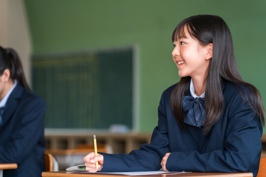 Elementary, middle, and high school girls taking tests in school classrooms or cram school classes.