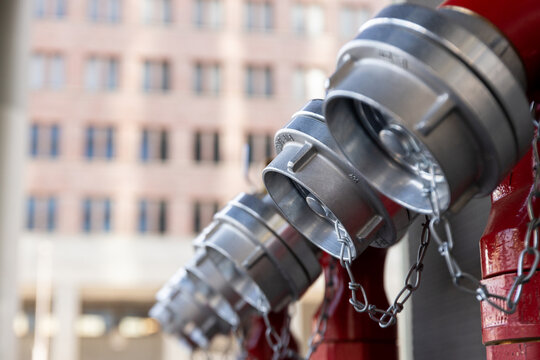 Fire hydrants arranged in a row within city environment