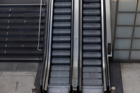 Escalators provide efficient vertical movement in busy city setting