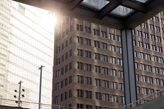 Sunlight glimmers off glass facades of skyscrapers in downtown area