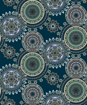 Seamless intricate mandala circle pattern featuring ornate geometric medallions and decorative ethnic motifs on a dark teal background